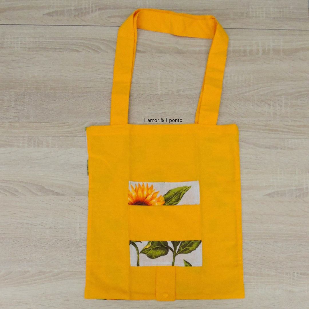 Saco de tecido amarelo com estampa de girassol