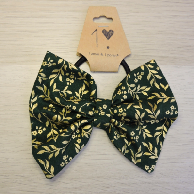 Elástico de cabelo com laço preto e amarelo em padrão floral e etiqueta de cartão