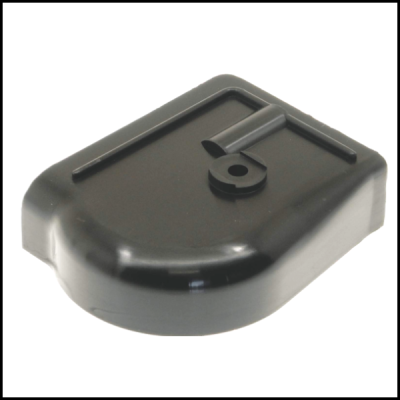 Tampa preta de plástico com relevo circular e linhas elevadas