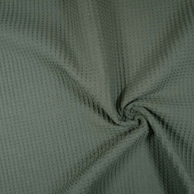 Tecido verde-acinzentado com padrão texturizado em relevo