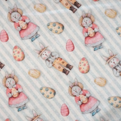 Tecido com padrão de coelhinhos e ovos de Páscoa coloridos