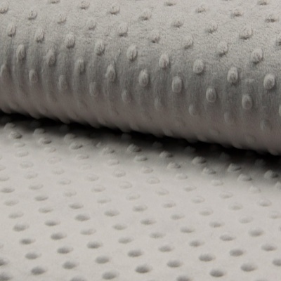 Tecido cinza claro texturizado com relevos ovoides