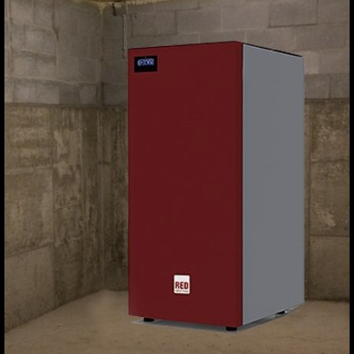 Máquina vermelha e cinzenta numa sala de betão