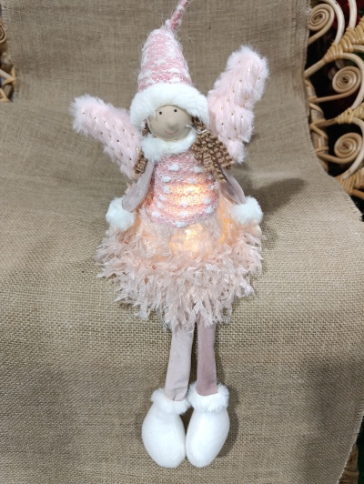 Menina Natal sentada com luz