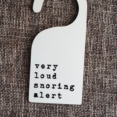 Door hanger 'very loud snoring alert'