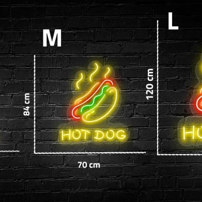 Sinais de néon representando cachorro quente e texto 'HOT DOG' em três tamanhos frente a parede de tijolos preta