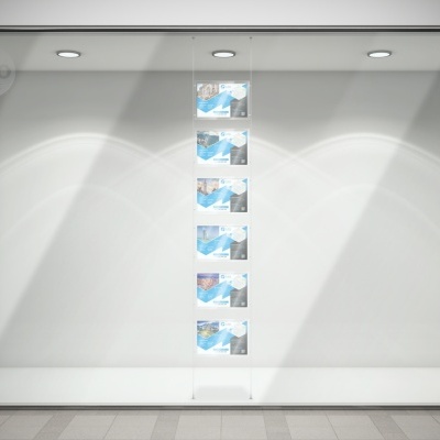 Vitrine de loja vazia com cinco cartazes verticais semelhantes e logótipo VIVO no canto