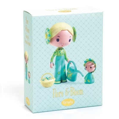 Embalagem azul claro com figuras de bonecas e texto Flore & Bloom tinyl