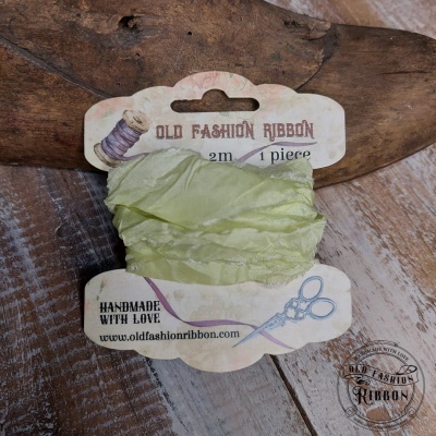 Fita de tecido verde claro em cartão vintage com texto e ilustrações