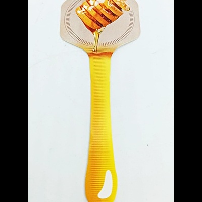 Colher de plástico amarelo com imagem de favo de mel no cabeçote