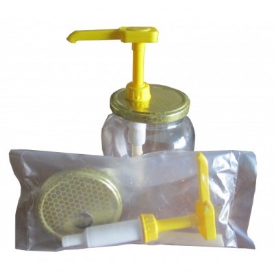 Bomba dispensadora plástica amarela com frasco transparente e uma peça extra embalada