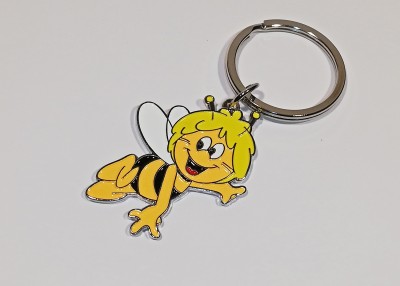 Chaveiro de abelha colorida com anel metálico num fundo branco