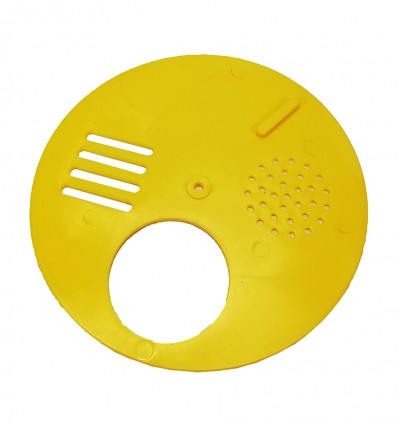 Disco amarelo redondo de plástico com recortes e perfurações.