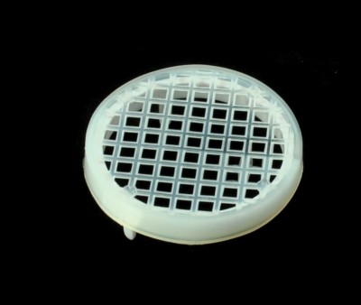 Grelha circular branca de plástico com padrão quadriculado