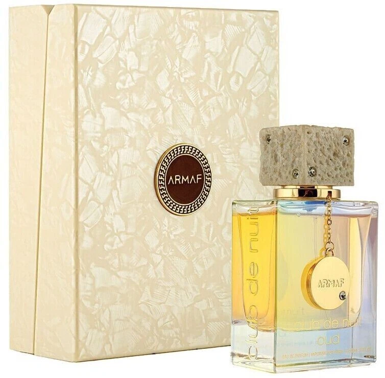Armaf Club de Nuit Oud Eau de Parfum 105 ml Frasco de perfume com tampa bege e caixa creme texturada com logo ARMAF