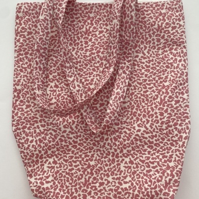 Saco de tecido rosa claro e branco