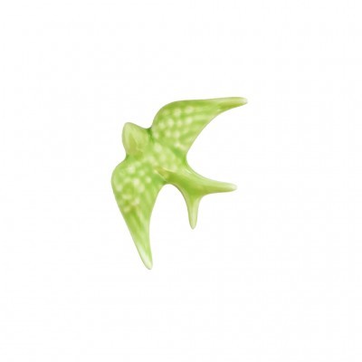 Figurinha de pássaro verde em cerâmica com manchas brancas