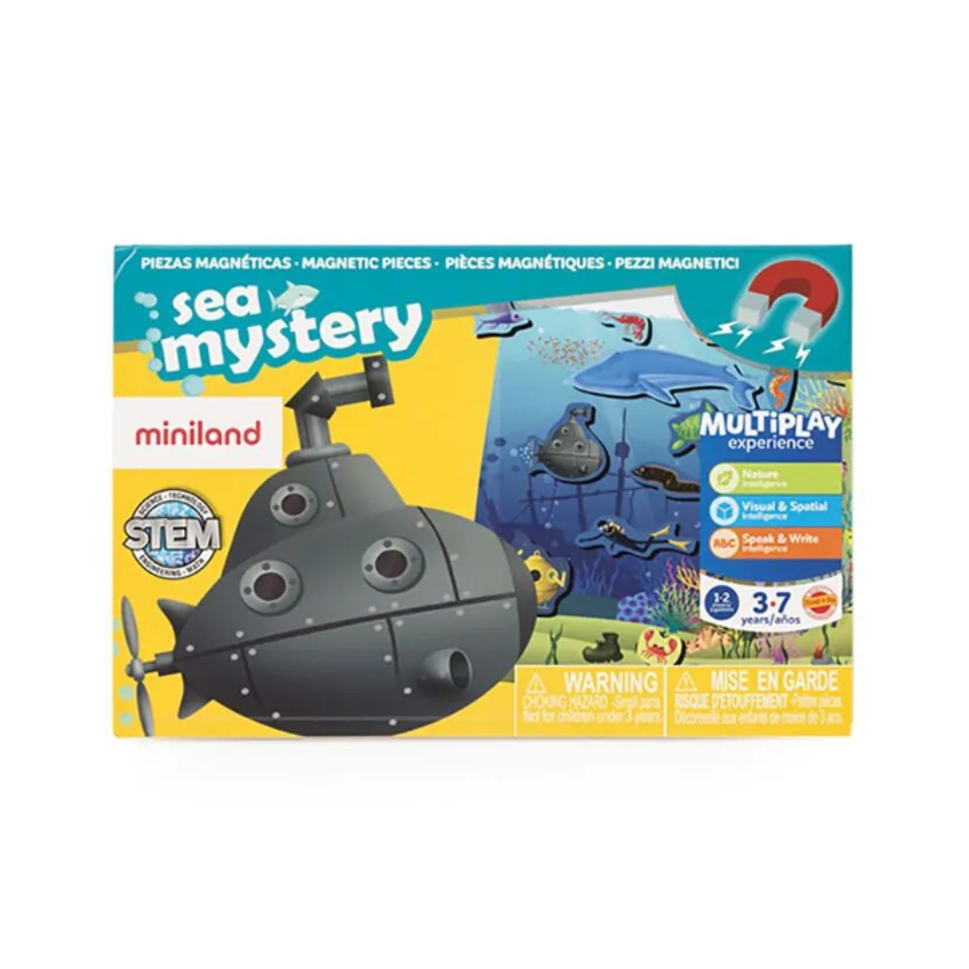 Brinquedo educativo Miniland Sea Mystery com peças magnéticas submarino preto e fundo oceano em embalagem amarela e azul
