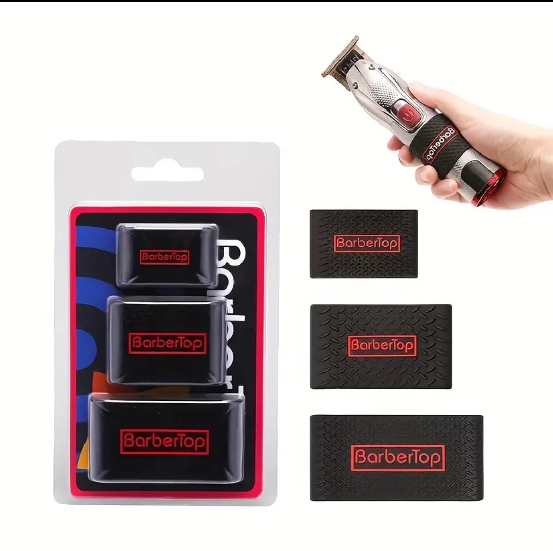 Suportes e tiras pretas com texto BarberTop em vermelho ao lado de máquina de cortar cabelo
