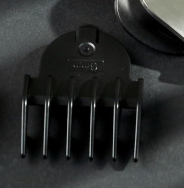 Pente guia preto de plástico com seis dentes e texto '6mm' embutido.