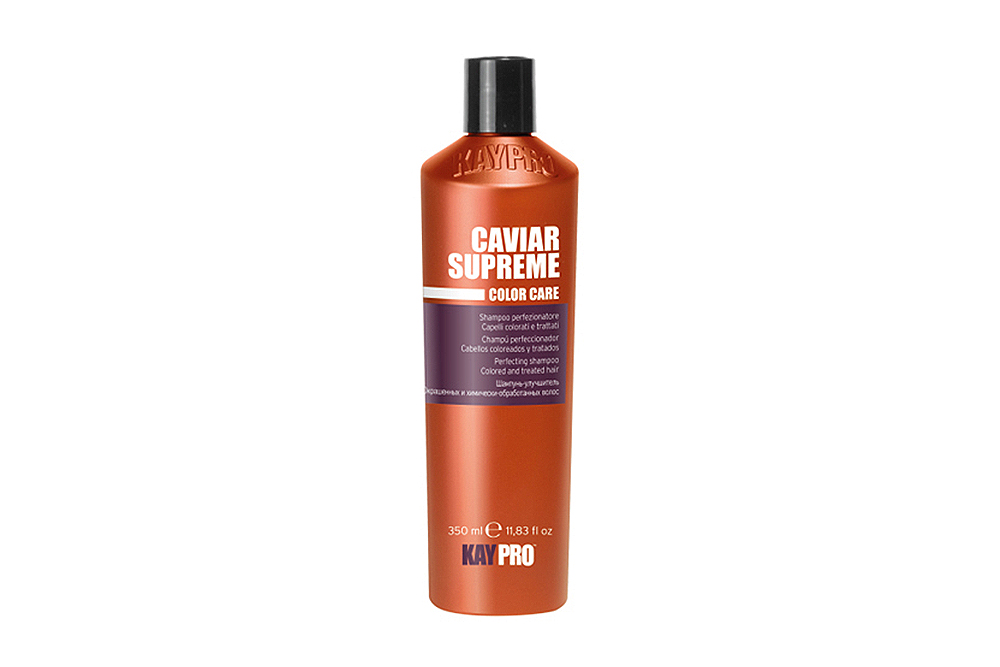 Frasco laranja de produto capilar Caviar Supreme