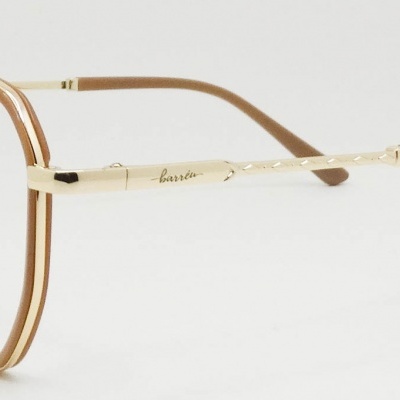 Óculos redondos com armação dourada e detalhes marrons