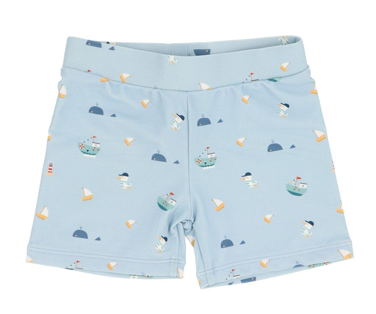 Calções de criança azuis com padrão de barcos e baleias
