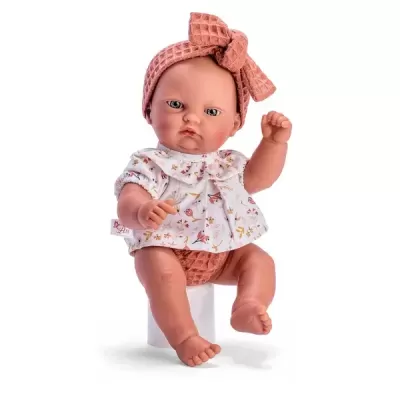 Boneca bebé com blusa branca estampada e faixa de cabeça cobre