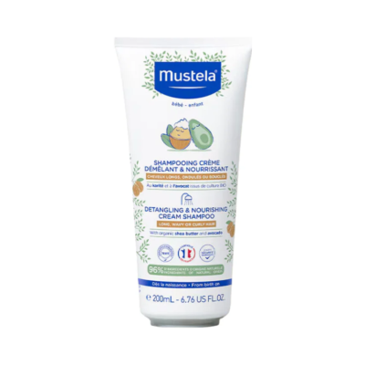 Frasco branco de champô Mustela para bebés com ilustração de abacate e noz de karité