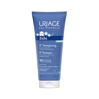 Champô bebé Uriage Eau Thermale em tubo azul com texto branco e verde