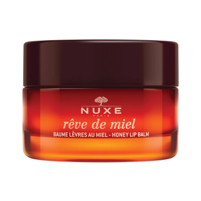 Bálsamo labial NUXE Paris em frasco âmbar com tampa castanha