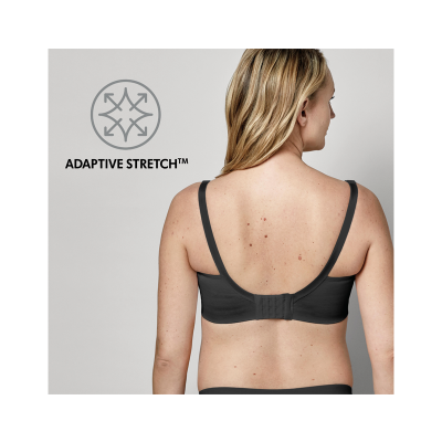 Mulher de costas a usar soutien preto com fecho ajustável e texto ADAPTIVE STRETCH™