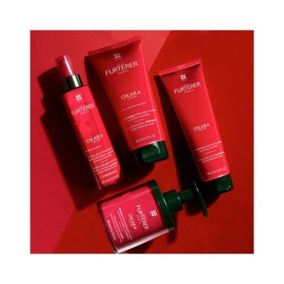 Produtos René Furterer OKARA em embalagens vermelhas com tampas verdes