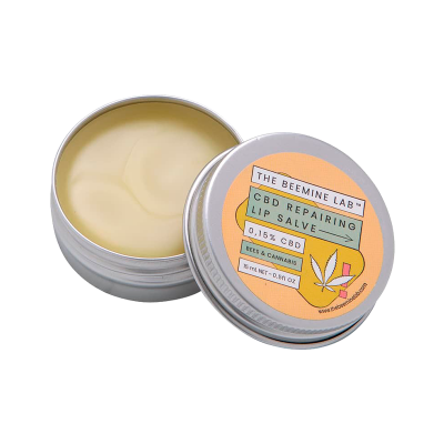 Bálsamo labial reparador num recipiente metálico prateado com tampa amarela