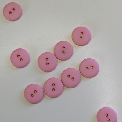 Botões rosa claro redondos com dois orifícios sobre fundo branco e texto Rosa Claro