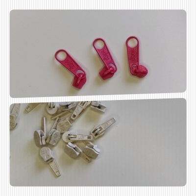 fechos de correr plásticos cor-de-rosa e brancos