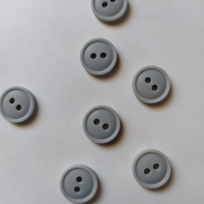 Set de sete botões redondos cinzentos com dois orifícios