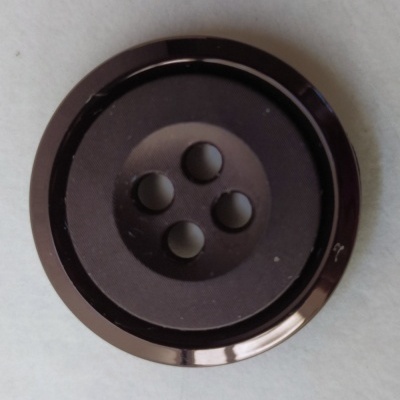 Botão redondo preto com quatro furos