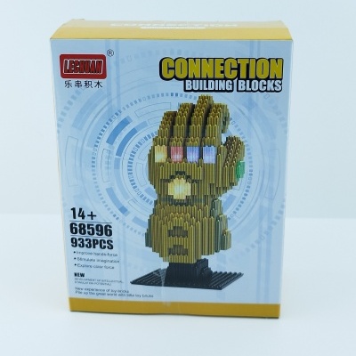 Caixa de blocos de construção LEGMA com imagem de uma luva dourada