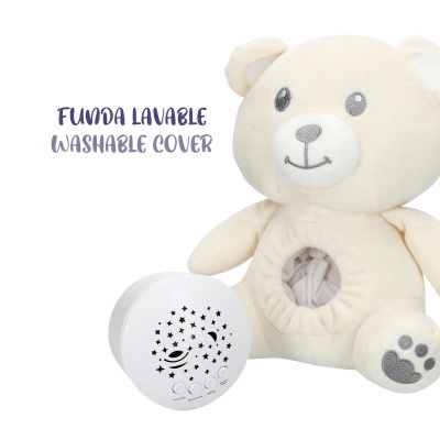 Ursinho de peluche creme com fenda circular e dispositivo branco com estrelas