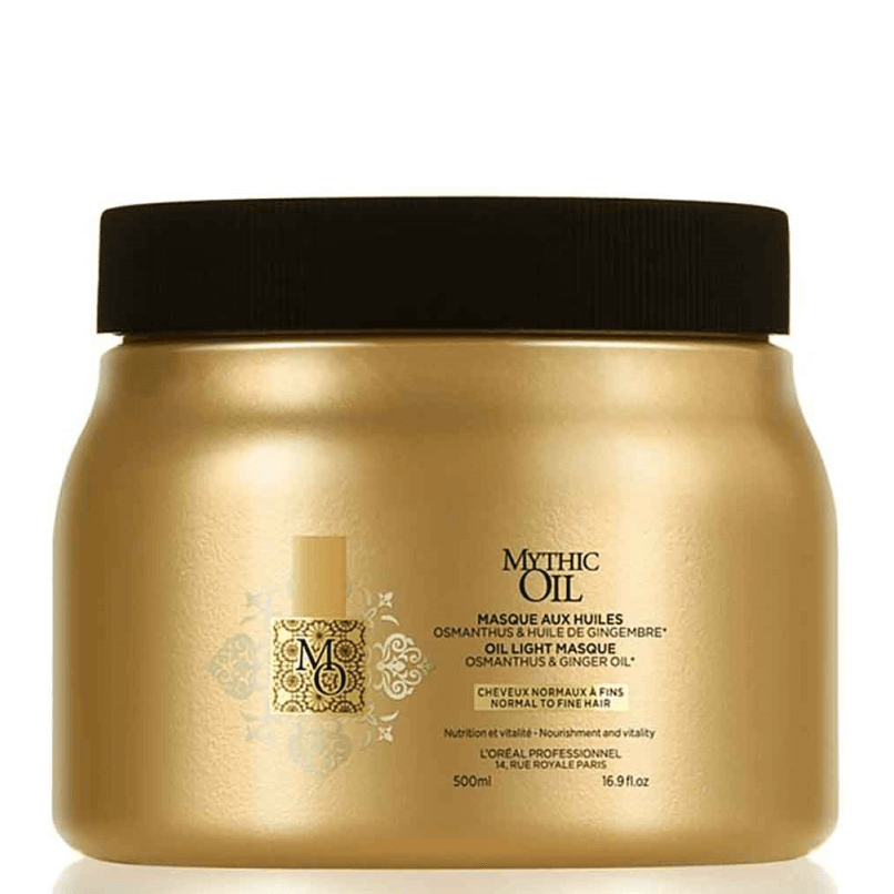 Frasco dourado com tampa preta da máscara capilar Mythic Oil com texto em francês e inglês.