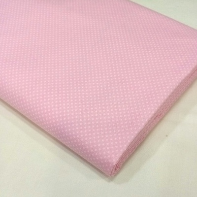 Pintinhas brancas em fundo rosa bebé