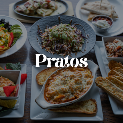 Vários pratos de comida numa mesa com a palavra 'Pratos' sobreposta.