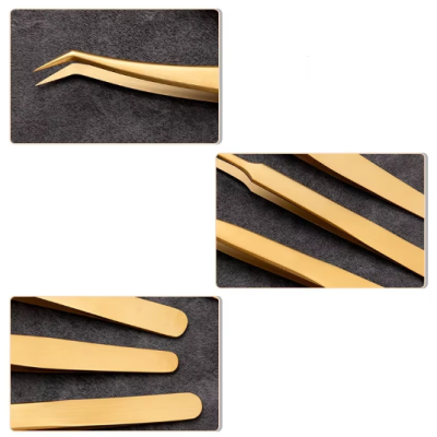 Conjunto de pinças douradas sobre tecido cinza