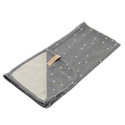 Manta cinzenta com pontos brancos e etiqueta TUTU'S