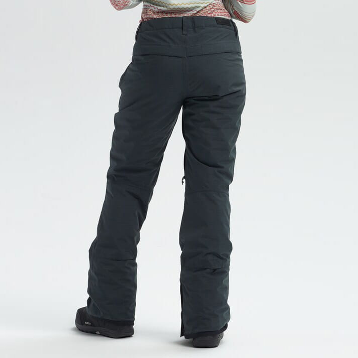 Calças pretas de tecido grosso com bolso lateral