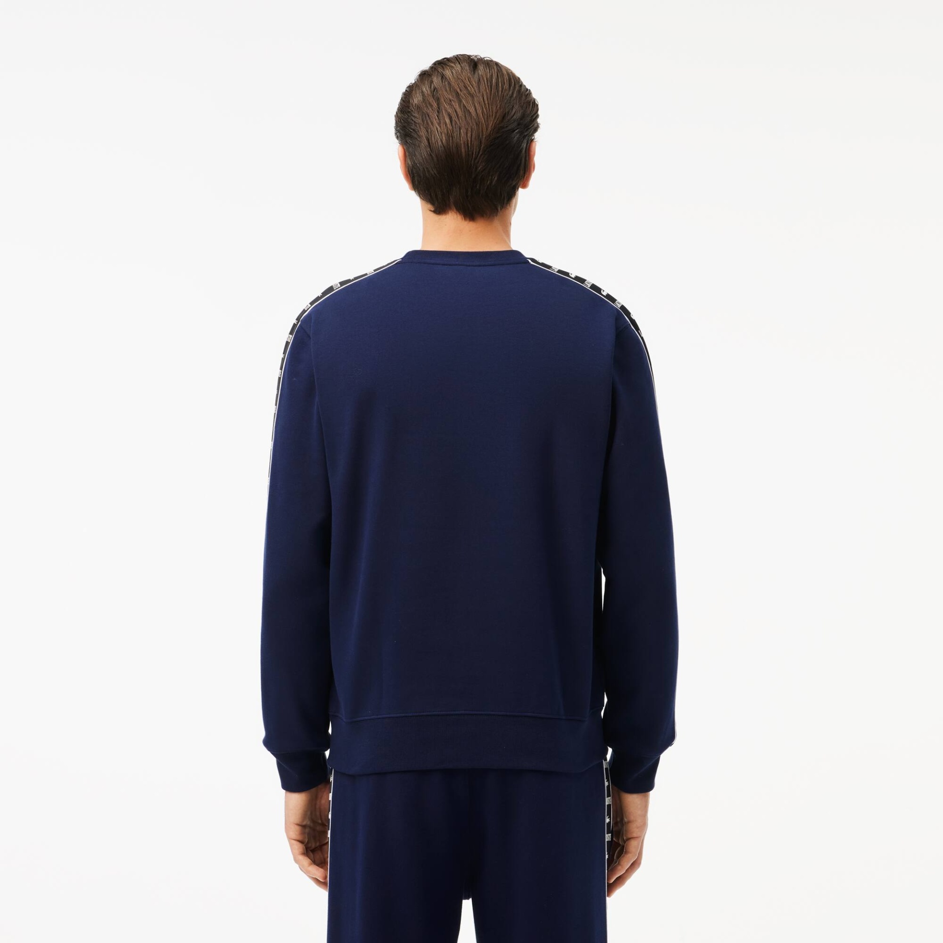 Sweatshirt azul-escuro de manga comprida vista de costas com fitas decorativas