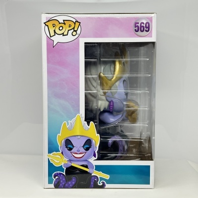 Figura POP! com personagem roxa e coroa amarela na caixa transparente