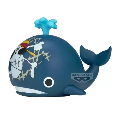 Figura de baleia azul escuro com decoração de caveira e texto BANPRESTO