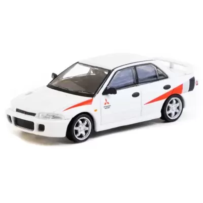 Miniatura de carro branco com detalhes vermelhos e pretos e texto Mitsubishi Motors